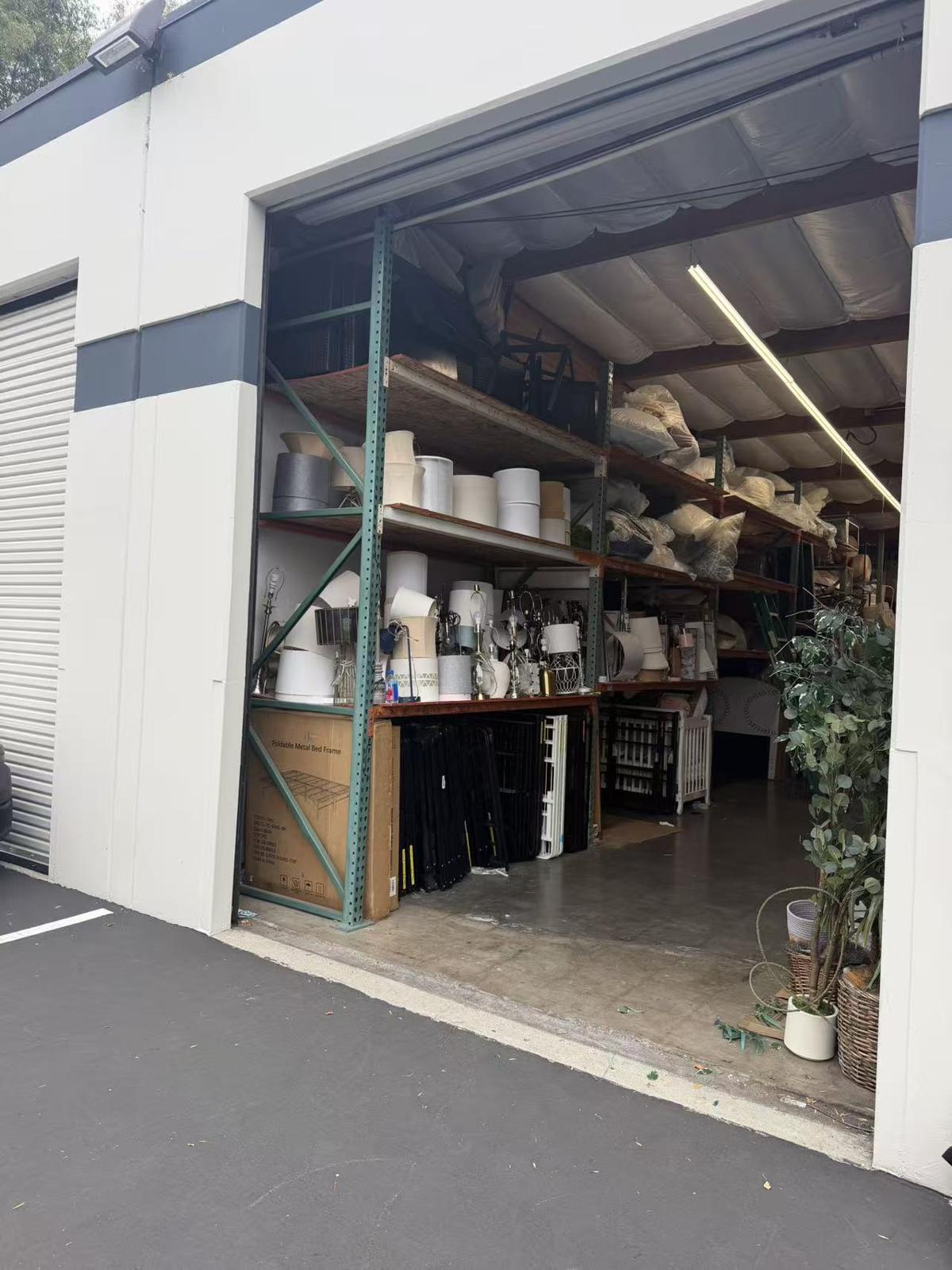 Shelves of household goods inside a Hello Movers storage bay
